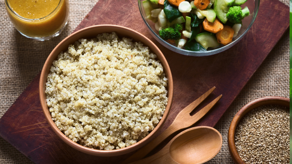 Bowl of cooked Quinoa with vegetables and smoothie 