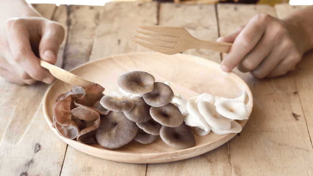 A person eating Assorted mushrooms for weight loss on a plate
