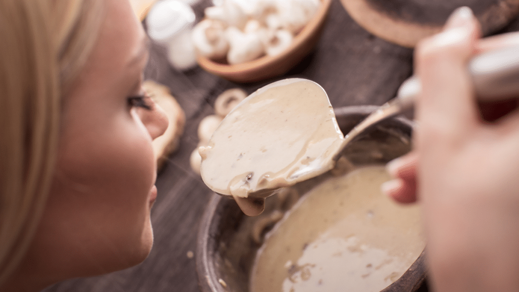 woman eating mushroom soup - mushrooms for weight loss 