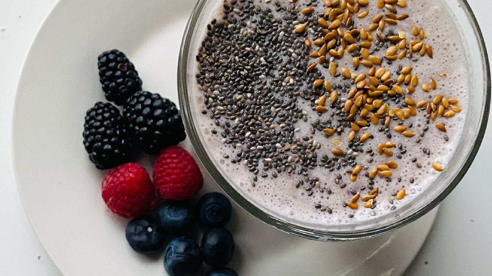 Smoothie bowl with chia seeds, flaxseed, and fresh berries
