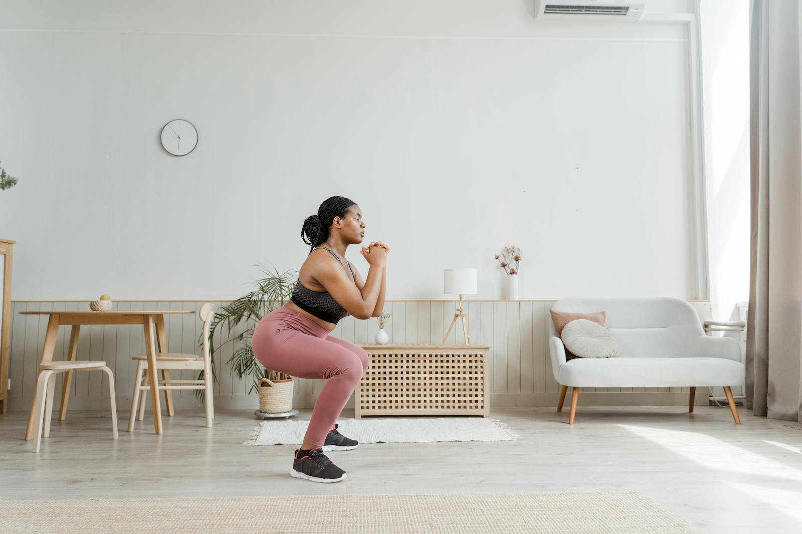 Woman doing goblet squat exercise