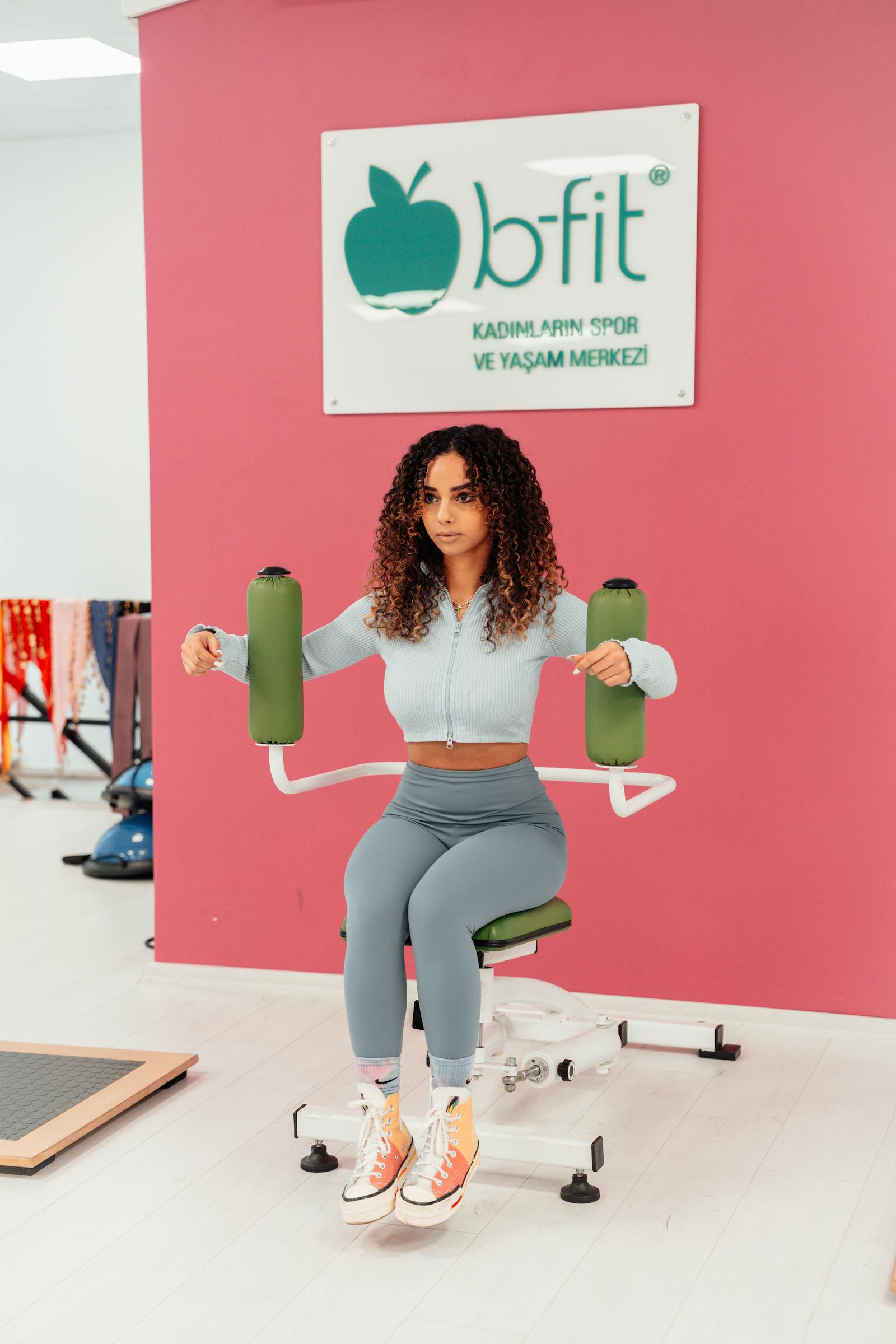 Woman doing a wall sit exercise for leg strength
