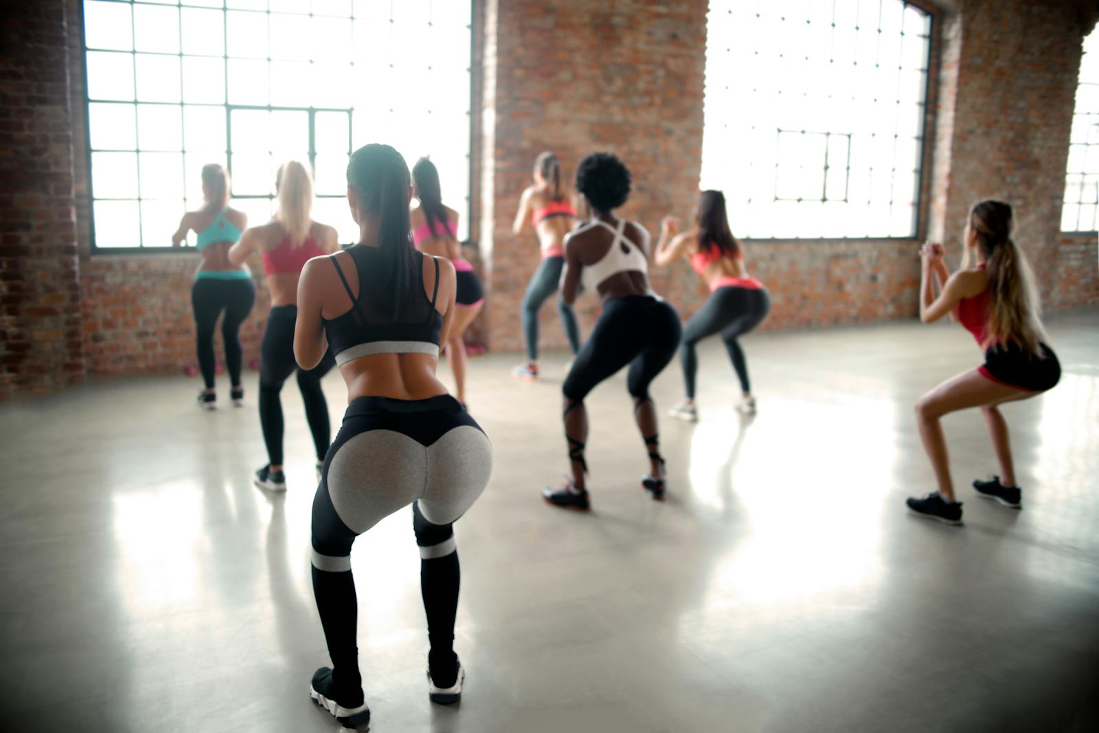 Women doing bodyweight squats for leg strength